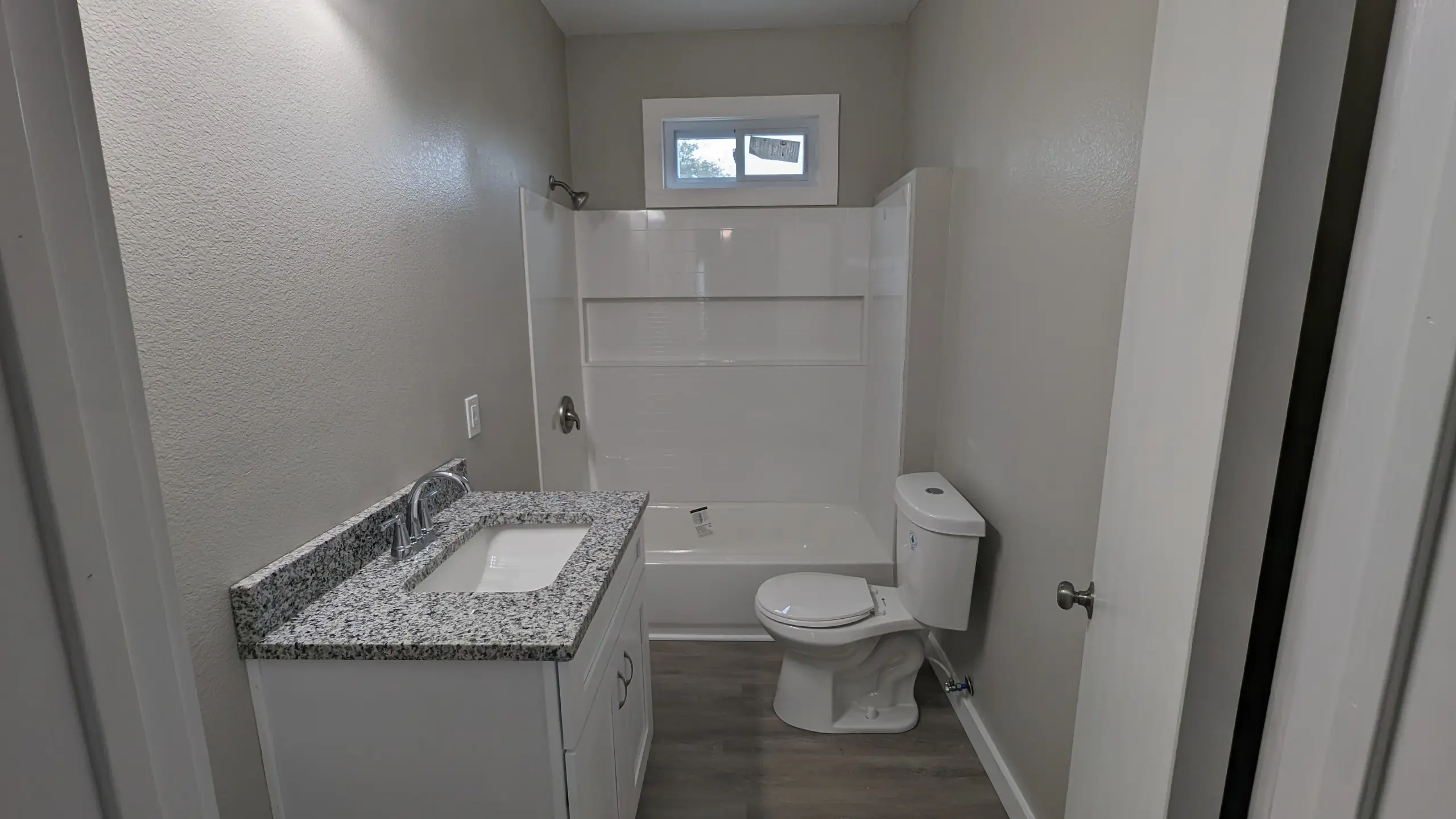 Bay View - after bathroom remodel, new fvanity, new toilet, new tub and shower surround, new window, new trim