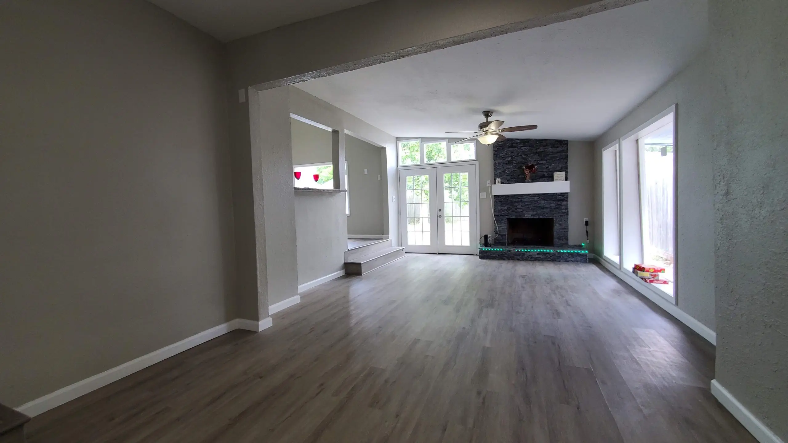 Moravian Village - living room remodel after flip, new french doors, new glass windows, resurfaced fireplace